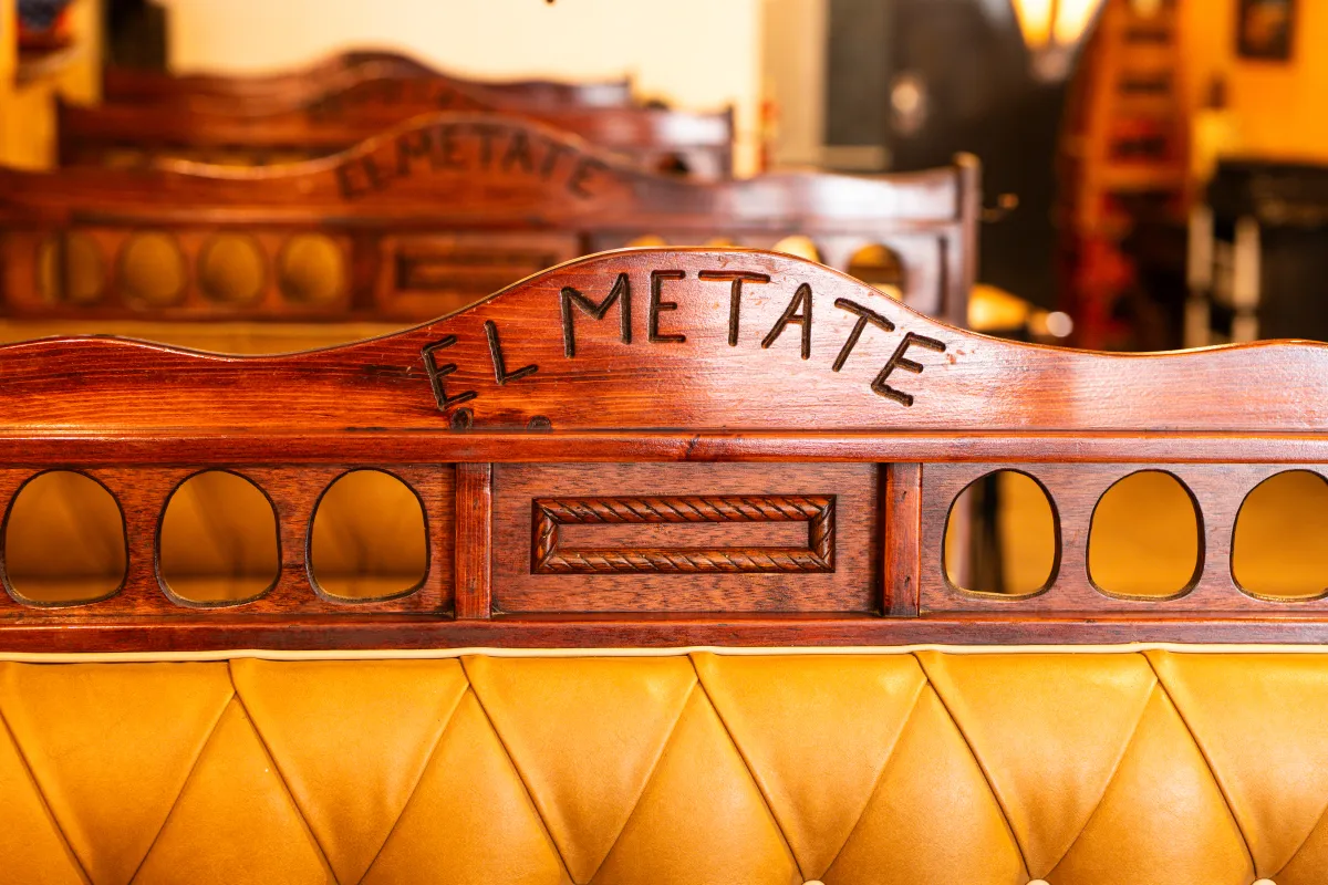 Carved El Metate sign